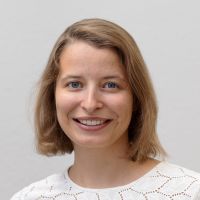 Tanja Hack - Sales Manager: Smiling woman with blue eyes and light brown hair down to her chin