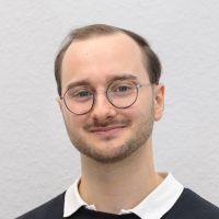 Fabian Machalett - QA Assistant: Man with short dark blond hair; three days beard and blue eyes.