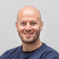 Philipp Bryant - Customer Success Manager: Smiling man with beard and blue eyes